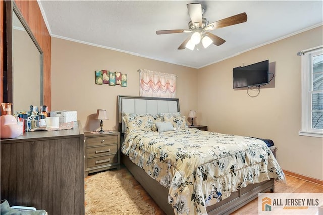 bedroom with multiple windows, crown molding, and ceiling fan