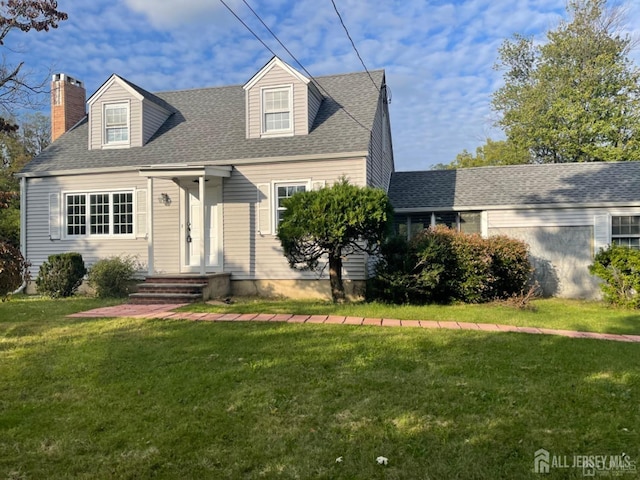 cape cod house with a front lawn