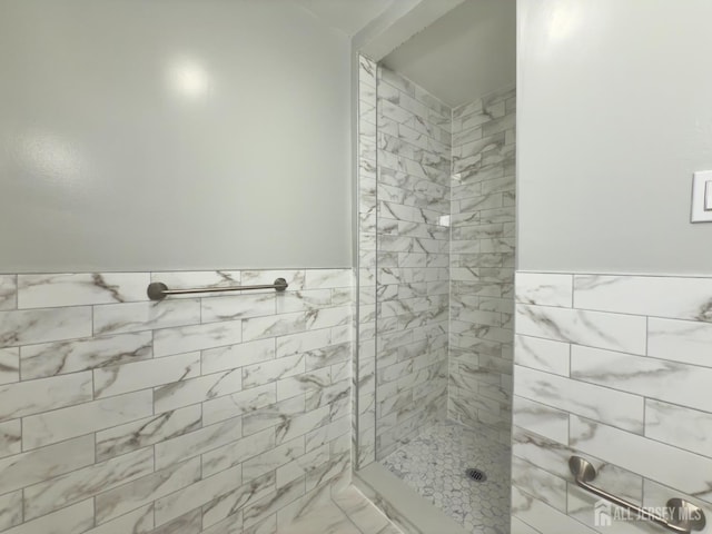 9 Lake Ave Unit 4A, East Brunswick, NJ 08816 - full bath with a tile shower, a wainscoted wall, tile walls, and marble finish floors