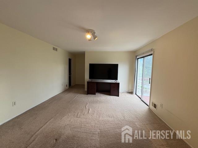 4 La Valencia Rd, Old Bridge, NJ 08857 - unfurnished living room with light carpet