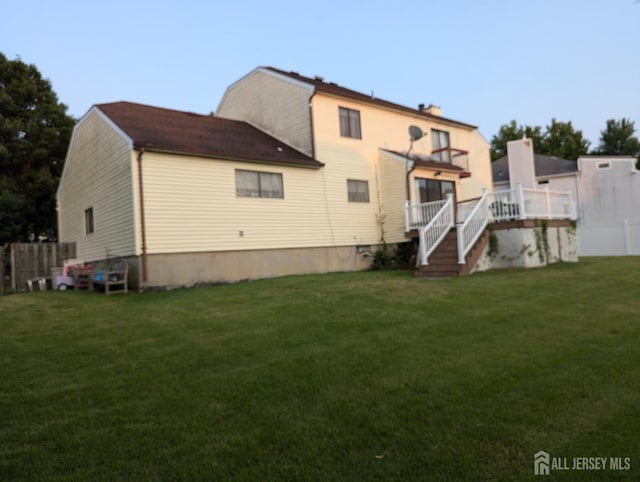 4 La Valencia Rd, Old Bridge, NJ 08857 - back of property featuring stairs and a wooden deck
