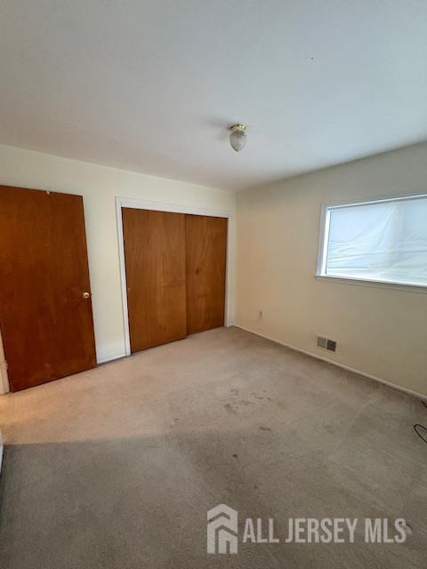 4 La Valencia Rd, Old Bridge, NJ 08857 - unfurnished bedroom with carpet flooring and a closet