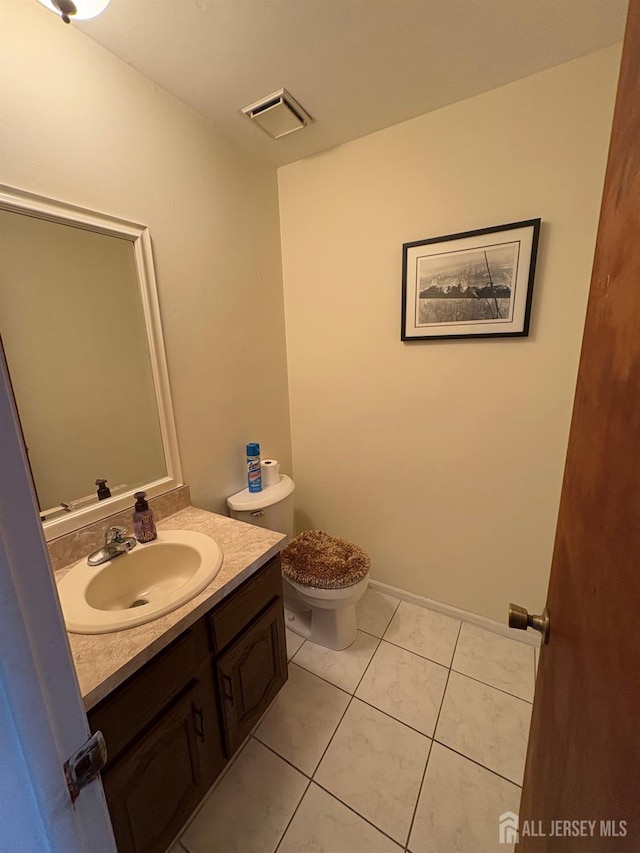 4 La Valencia Rd, Old Bridge, NJ 08857 - half bath with vanity, toilet, and tile patterned flooring