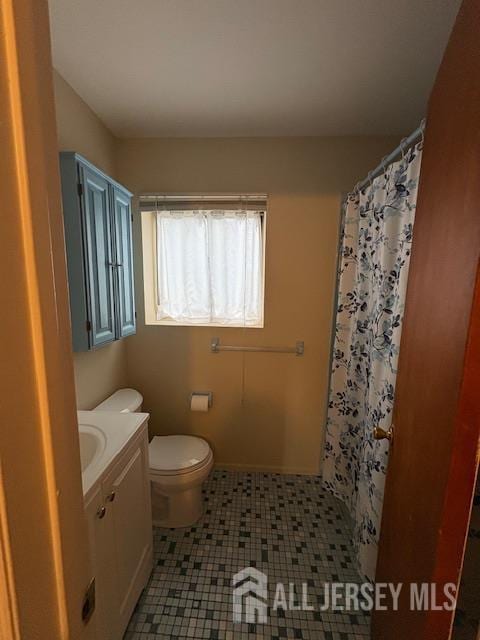4 La Valencia Rd, Old Bridge, NJ 08857 - bathroom with toilet, vanity, tile patterned floors, and a shower with shower curtain