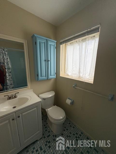 4 La Valencia Rd, Old Bridge, NJ 08857 - bathroom with vanity, toilet, tile patterned floors, and curtained shower