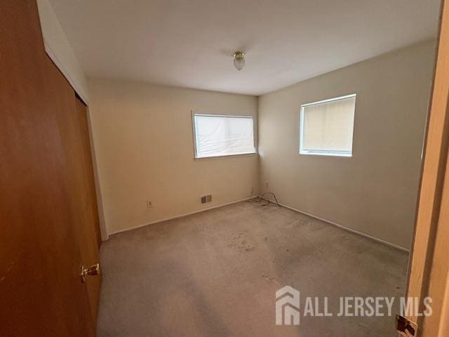4 La Valencia Rd, Old Bridge, NJ 08857 - unfurnished bedroom featuring carpet flooring and a closet