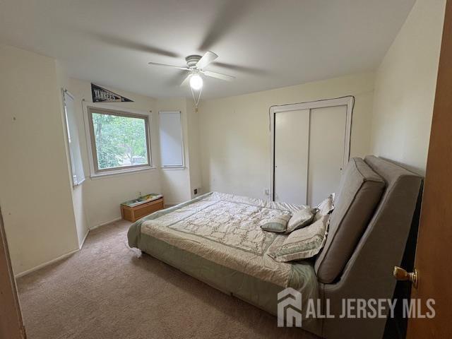4 La Valencia Rd, Old Bridge, NJ 08857 - carpeted bedroom with ceiling fan, a closet, and baseboards