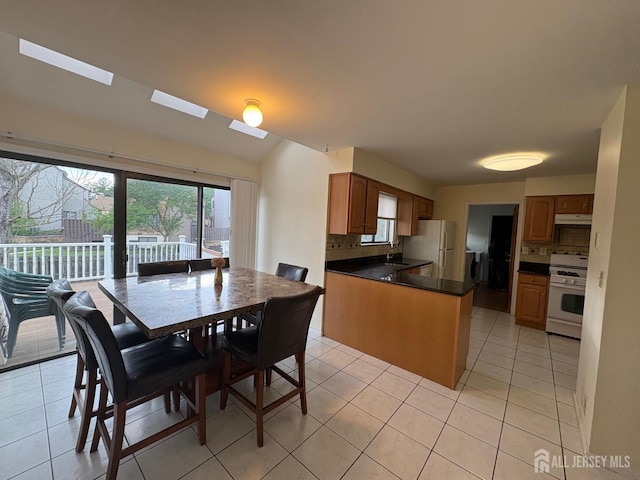4 La Valencia Rd, Old Bridge, NJ 08857 - dining space with light tile patterned floors and washer / clothes dryer