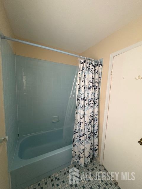 4 La Valencia Rd, Old Bridge, NJ 08857 - bathroom with tile patterned floors and shower / bath combo with shower curtain