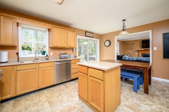2-A Lake Ave, Helmetta, NJ 08828 - kitchen featuring stainless steel dishwasher, a sink, a kitchen island, hanging light fixtures, and light stone countertops