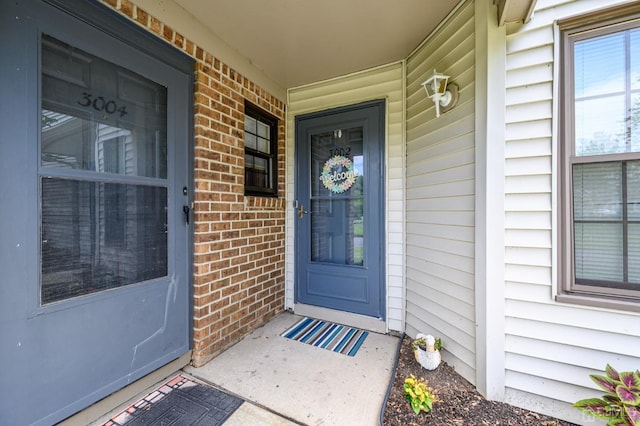 3002 Lighthouse Ln, Sayreville, NJ 08859 - doorway to property with brick siding and a porch