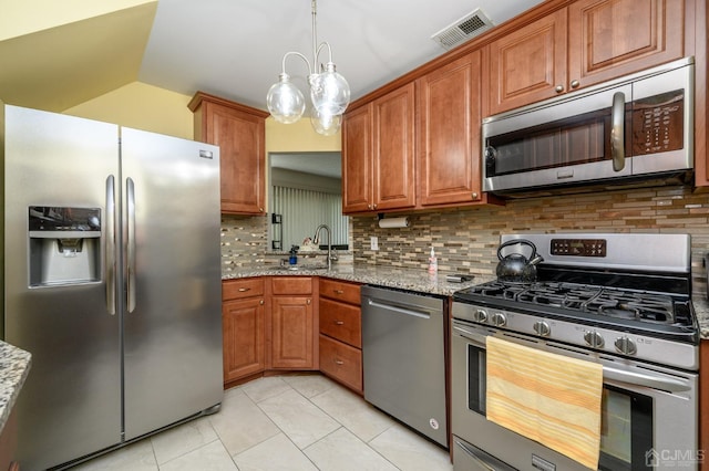 3002 Lighthouse Ln, Sayreville, NJ 08859 - kitchen with stainless steel appliances, backsplash, and light stone countertops