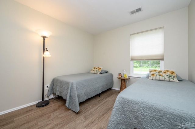 3002 Lighthouse Ln, Sayreville, NJ 08859 - bedroom with wood finished floors and baseboards