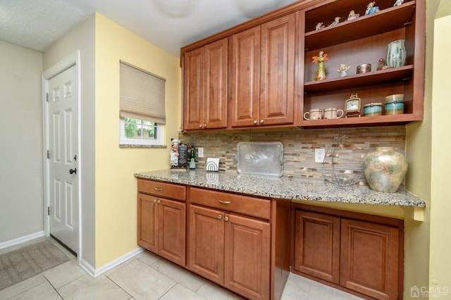 3002 Lighthouse Ln, Sayreville, NJ 08859 - bar with backsplash, baseboards, and light tile patterned floors