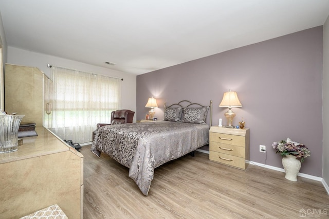 3002 Lighthouse Ln, Sayreville, NJ 08859 - bedroom featuring light wood-style floors and baseboards