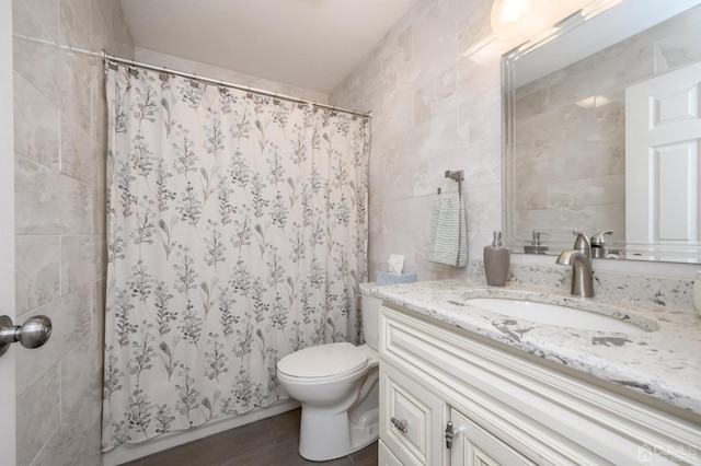 3002 Lighthouse Ln, Sayreville, NJ 08859 - full bathroom featuring tile walls, vanity, toilet, curtained shower, and tile patterned floors