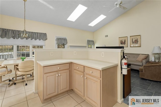 31 Cameron Ct, Monroe, NJ 08831 - kitchen featuring light brown cabinets, light countertops, open floor plan, light tile patterned floors, and a ceiling fan