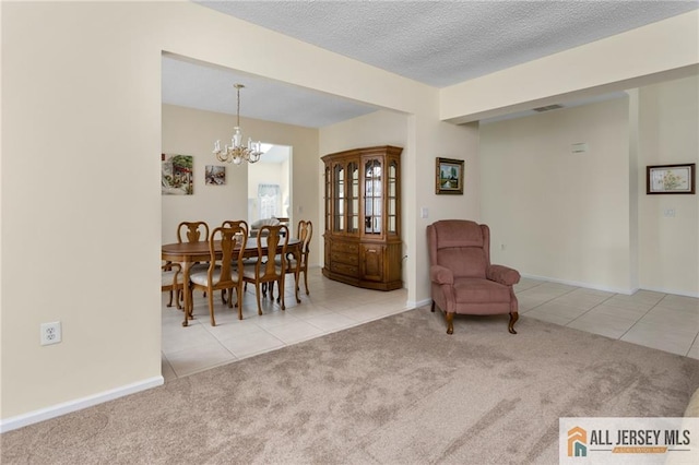 31 Cameron Ct, Monroe, NJ 08831 - tiled dining room featuring a chandelier, carpet, a textured ceiling, and baseboards