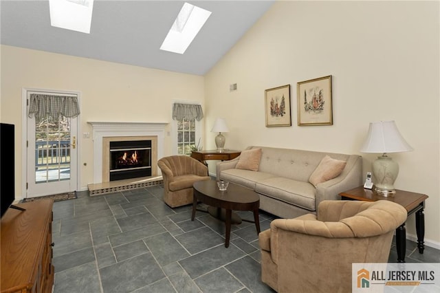 31 Cameron Ct, Monroe, NJ 08831 - living area with a skylight, a lit fireplace, and high vaulted ceiling