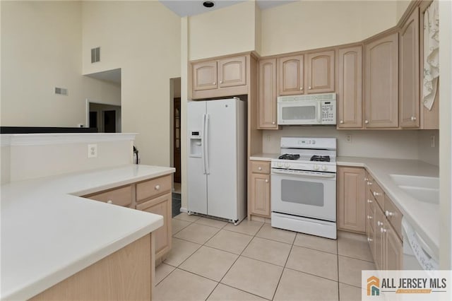 31 Cameron Ct, Monroe, NJ 08831 - kitchen featuring white appliances, light brown cabinetry, a sink, light countertops, and light tile patterned floors