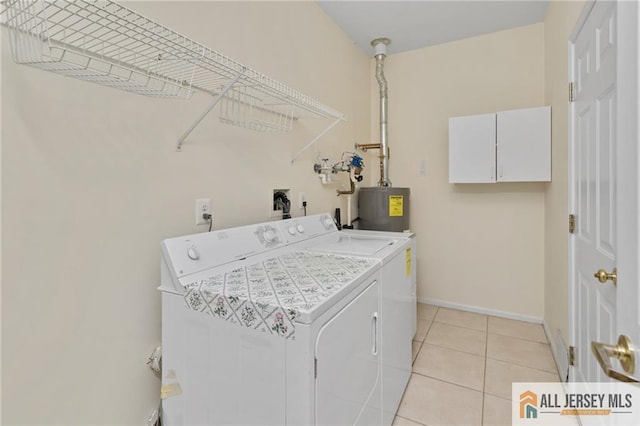 31 Cameron Ct, Monroe, NJ 08831 - washroom with separate washer and dryer, baseboards, electric water heater, cabinet space, and light tile patterned floors