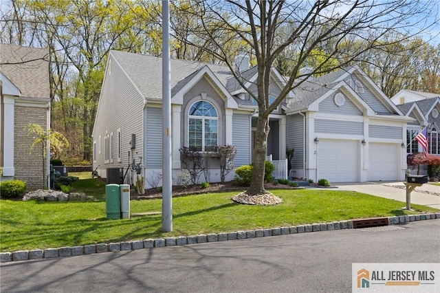 31 Cameron Ct, Monroe, NJ 08831 - ranch-style house with concrete driveway, a garage, and a front yard