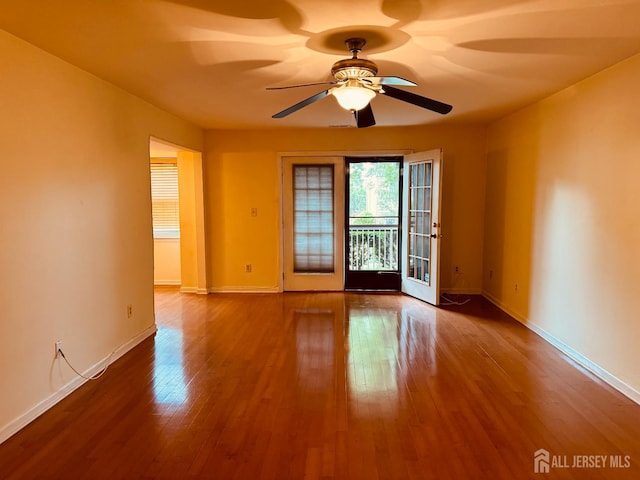404 Newport Ct, Fords, NJ 08863 - empty room featuring a ceiling fan, wood finished floors, and baseboards