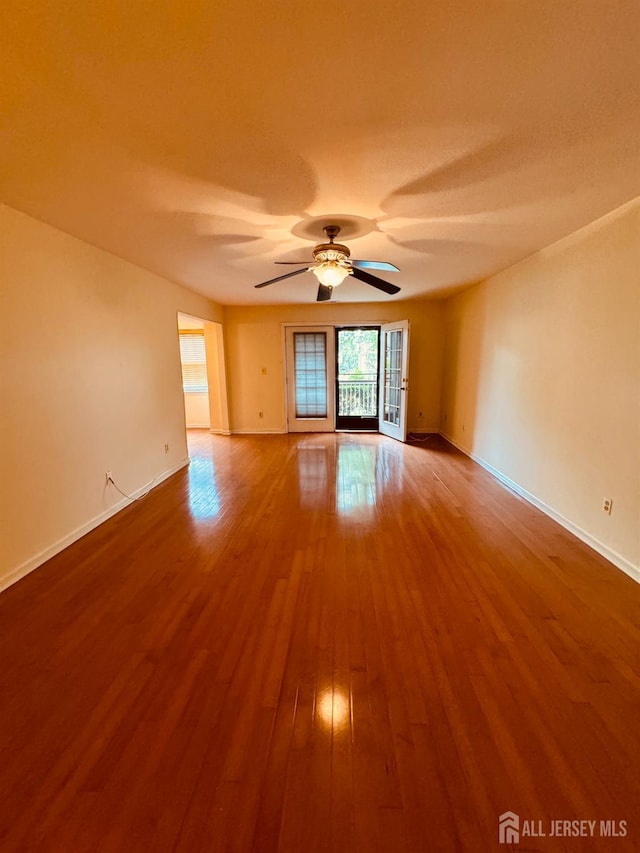 404 Newport Ct, Fords, NJ 08863 - unfurnished room with wood finished floors, baseboards, and a ceiling fan