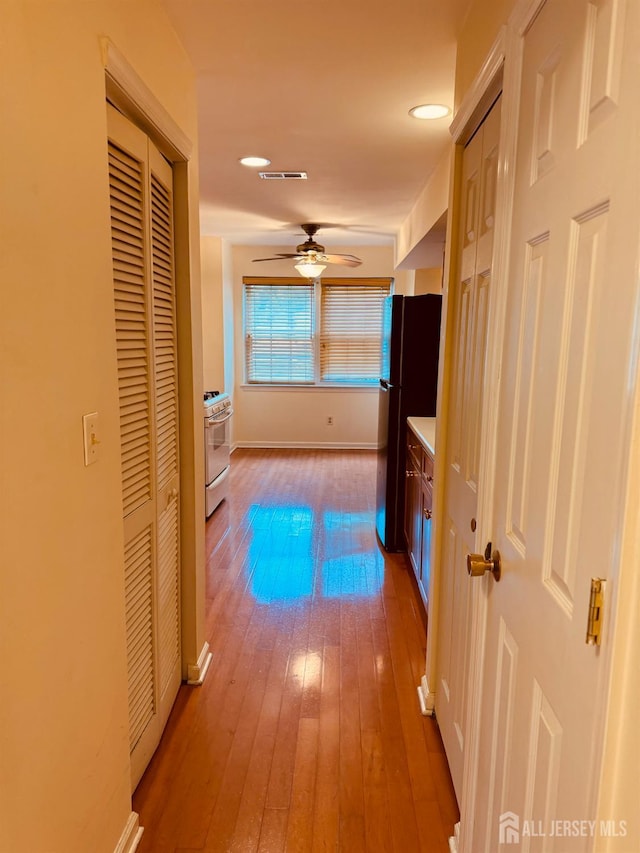404 Newport Ct, Fords, NJ 08863 - hallway featuring hardwood / wood-style floors, baseboards, and recessed lighting