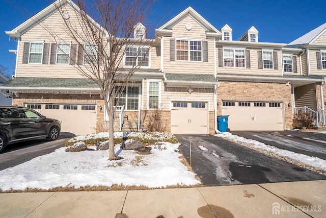 multi unit property featuring a garage