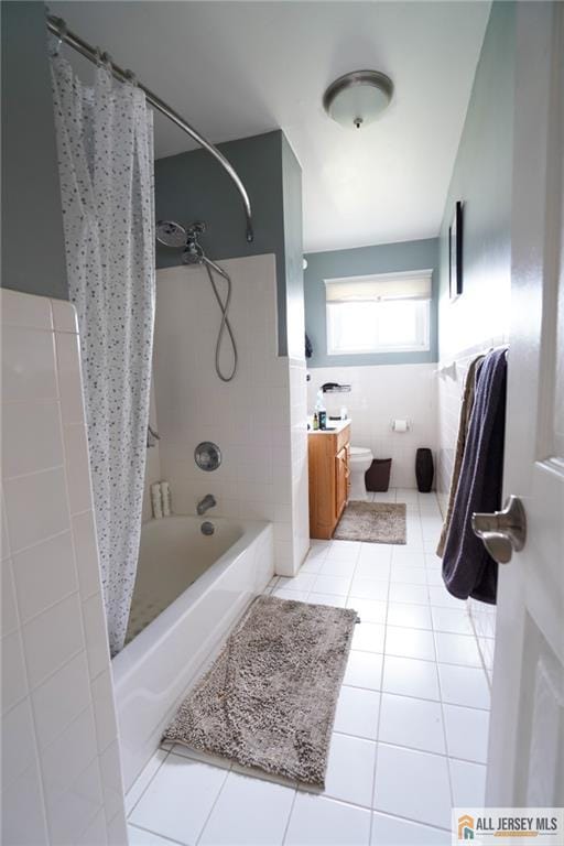 3060 Bordentown Ave, Old Bridge, NJ 08859 - bathroom with shower / tub combo with curtain, tile patterned flooring, toilet, and tile walls