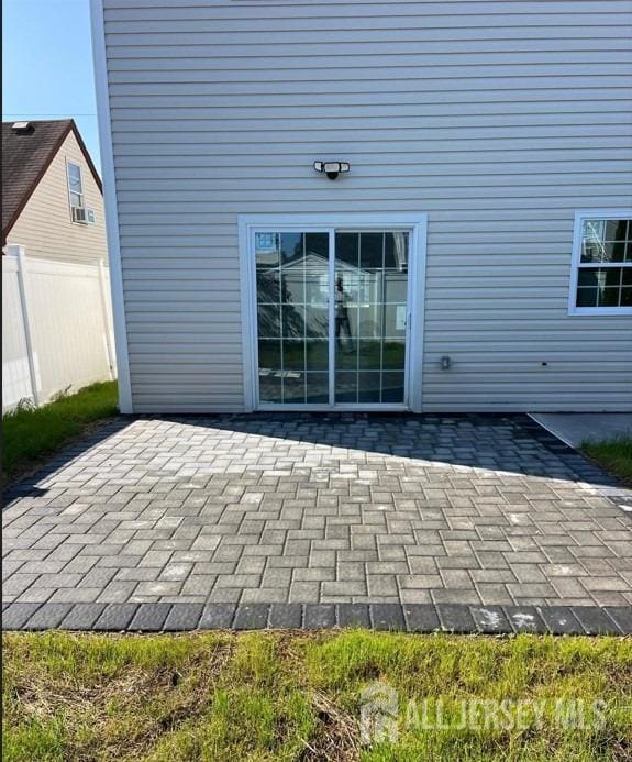 view of patio featuring fence