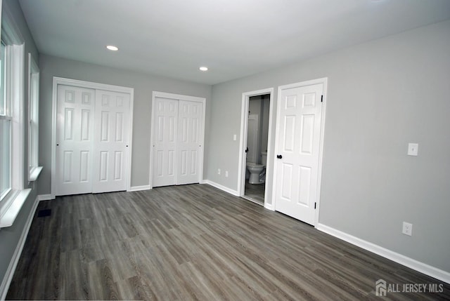 54 Castle Pointe Blvd, Piscataway, NJ 08854 - unfurnished bedroom featuring dark wood-style floors, baseboards, two closets, recessed lighting, and ensuite bathroom