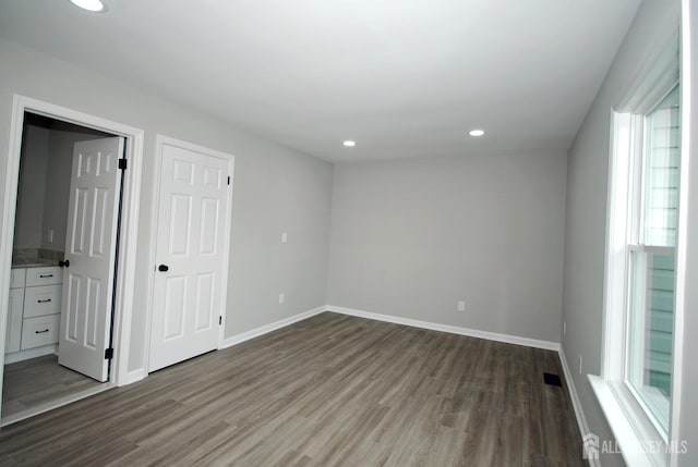 54 Castle Pointe Blvd, Piscataway, NJ 08854 - unfurnished bedroom featuring wood finished floors, recessed lighting, baseboards, and ensuite bath