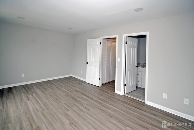 54 Castle Pointe Blvd, Piscataway, NJ 08854 - unfurnished bedroom with wood finished floors and baseboards