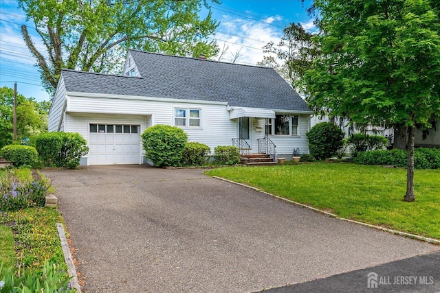view of front facade with an attached garage, roof with shingles, asphalt driveway, and a front lawn