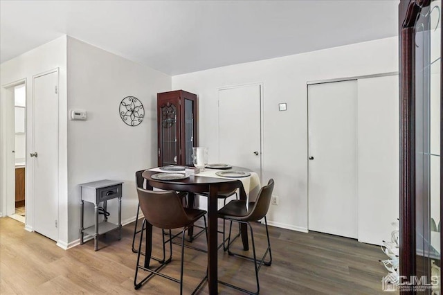 dining room with hardwood / wood-style flooring