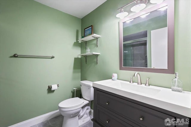 bathroom with vanity, toilet, and tile patterned flooring