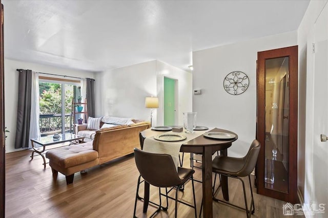 dining room featuring wood-type flooring