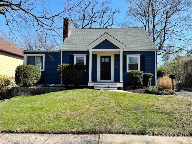130 Maple Pl S, Plainfield, NJ 07080 - view of front facade featuring a chimney, a front yard, and a shingled roof
