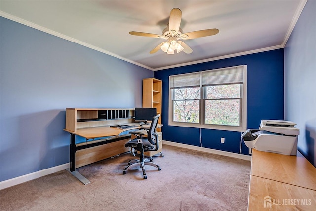 carpeted home office featuring crown molding, baseboards, and a ceiling fan