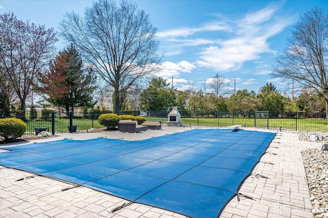 view of swimming pool with a fenced in pool, a patio area, a diving board, and fence