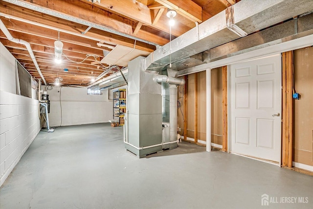 basement featuring heating unit