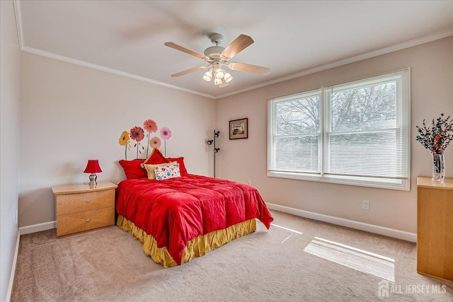 bedroom with crown molding, light colored carpet, and baseboards
