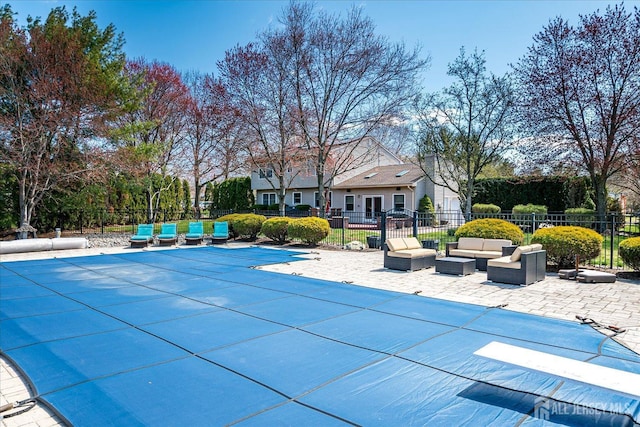 view of swimming pool with fence, an outdoor hangout area, a fenced in pool, and a patio