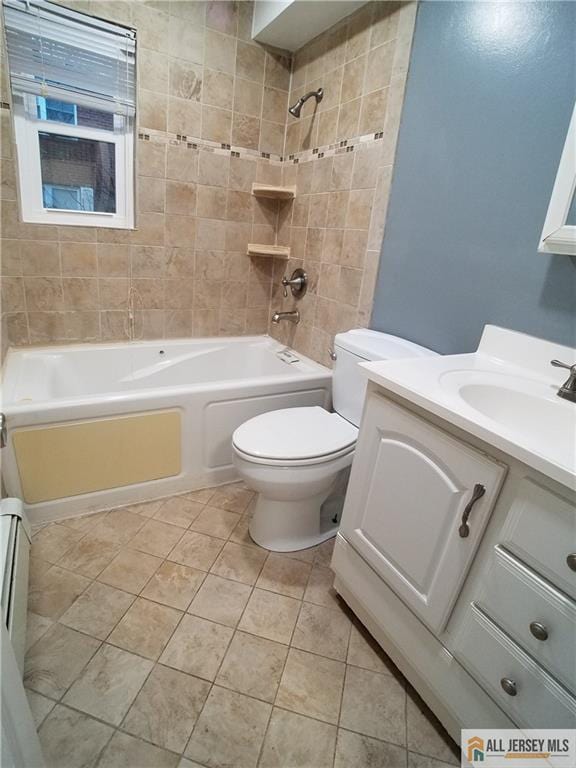 full bathroom featuring tile patterned floors, toilet, vanity, and bathing tub / shower combination