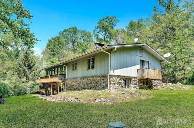 34 Stony Brook Rd, Blairstown, NJ 07825 - view of home's exterior featuring a yard, stone siding, and a wooden deck
