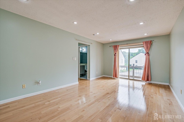 68 Kelly Dr, Edison, NJ 08820 - empty room with a textured ceiling, light wood-style flooring, and recessed lighting