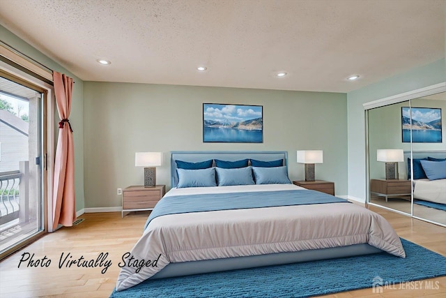 68 Kelly Dr, Edison, NJ 08820 - bedroom featuring light wood-type flooring, recessed lighting, access to exterior, a closet, and a textured ceiling