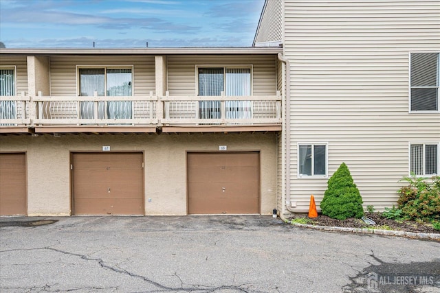 68 Kelly Dr, Edison, NJ 08820 - view of property with an attached garage and driveway